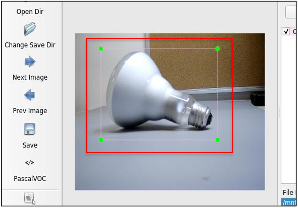 A light bulb on a table Description automatically generated